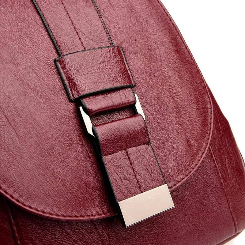 Spacious interior of a women's water-resistant leather travel backpack. Organized for daily essentials.