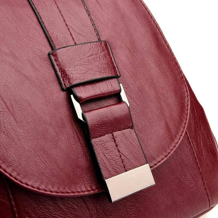 Spacious interior of a women's water-resistant leather travel backpack. Organized for daily essentials.