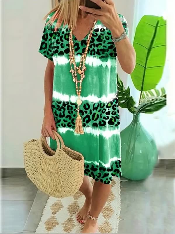 Effortless women's short sleeve shift dress with a modern bold print & V-neck. Perfect for versatile summer fashion.