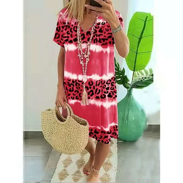 Relaxed fit women's dress with a striking bold print and flattering V-neck. Great for beach style & casual comfort.