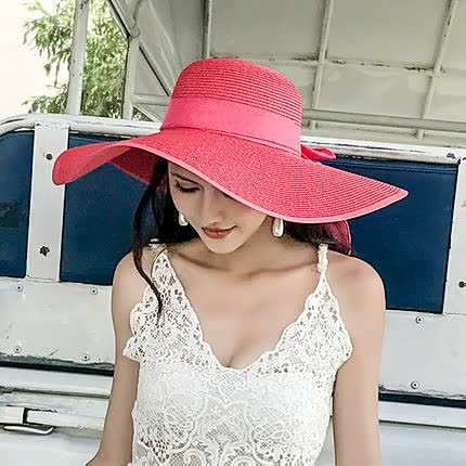 UV protective wide brim straw sun hat for women, featuring a decorative bow, ideal for beach & outdoor.