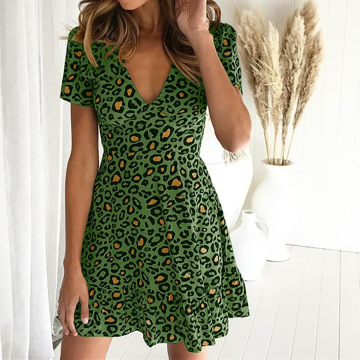 Trendy women's leopard print fit & flare mini dress. Short sleeve V-neck for casual or party wear.