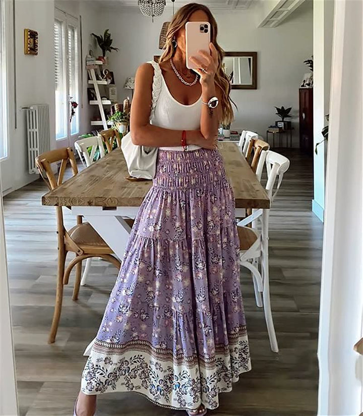 Women's flowing bohemian tiered midi skirt with a vibrant print, perfect for summer fashion & casual wear.