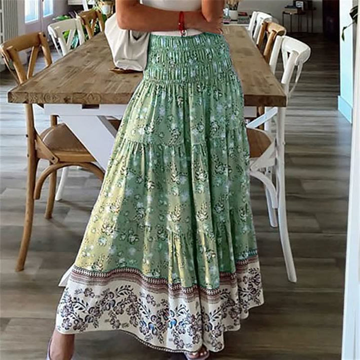 Women's printed bohemian tiered midi skirt, a flowing and comfortable summer style with an elastic waistband.