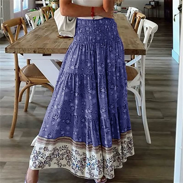 Relaxed fit women's bohemian midi skirt, a comfortable and flowing tiered style for summer casual wear.