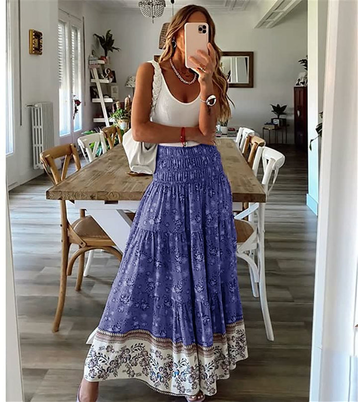 Stylish women's bohemian midi skirt with a tiered design and flowing fabric, great for summer and vacation.