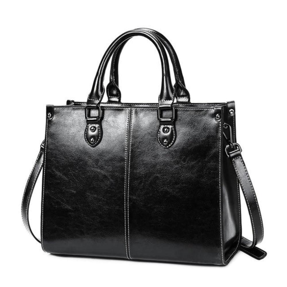Elegant women's shoulder tote handbag with zipper closure, a functional everyday leather bag for women.