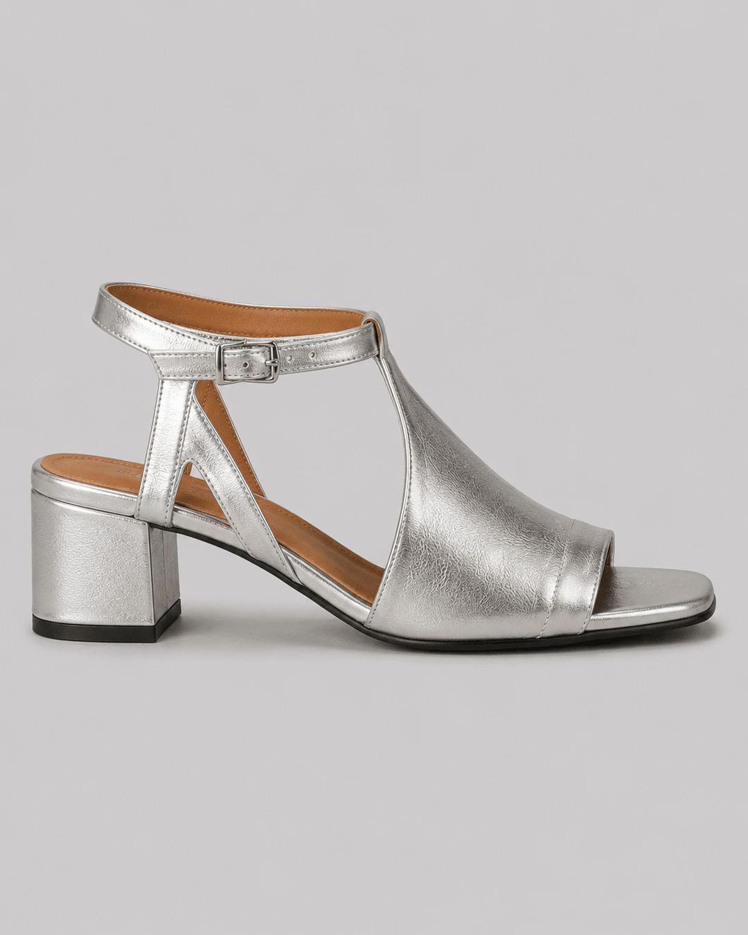 Shimmering silver block heel sandals for women, perfect for elegant summer parties & occasion wear.