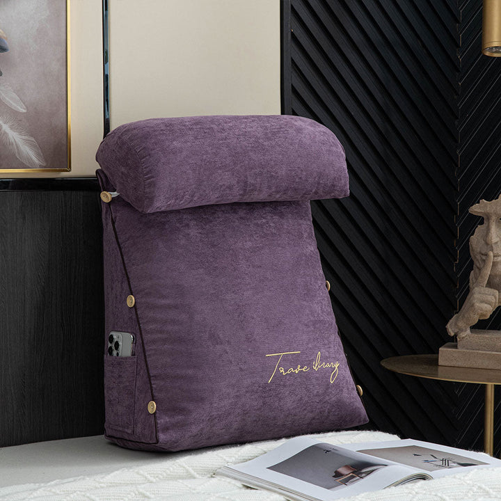Soft reading pillow with arm support, perfect for a cozy nook, offering ergonomic back support.