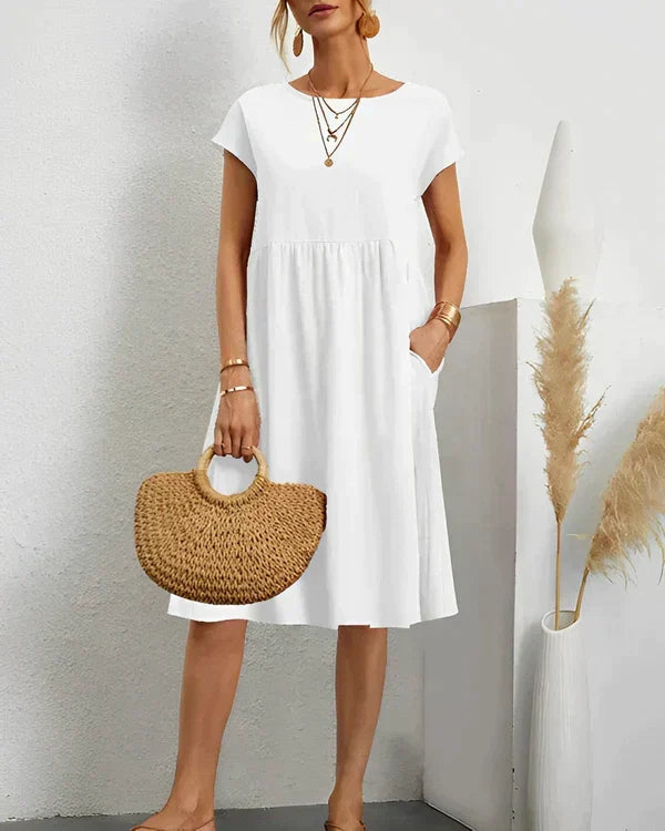 Elegant women's round neck midi dress, perfect for versatile styling from day to evening. Classic & chic.