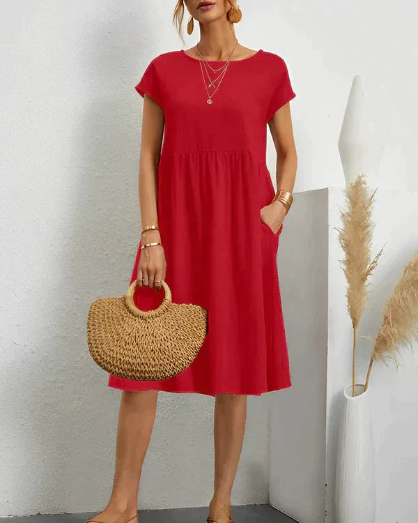 Chic women's versatile midi dress with a flattering round neck, suitable for office, parties, or everyday wear.