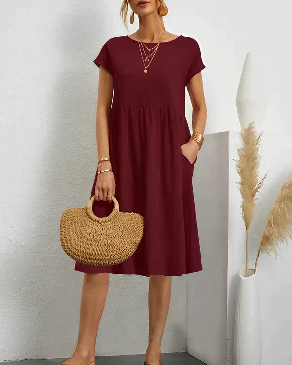 Classic women's round neck dress, offering elegant versatility for any occasion. A comfortable, stylish midi.