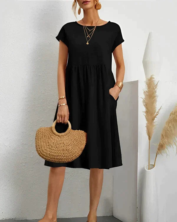 Graceful women's versatile midi dress featuring a classic round neck, perfect for a refined casual or formal look.