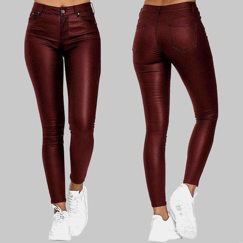 Blue unisex high-waisted skinny pants. Stretchy, sleek finish, offering a comfortable and trendy slim fit.