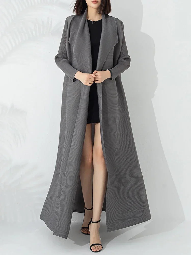 Stylish women's belted A-line long coat with funnel neck for versatile fall & winter fashion elegance.