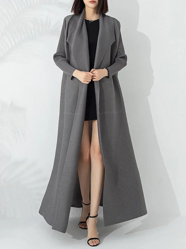 Stylish women's belted A-line long coat with funnel neck for versatile fall & winter fashion elegance.