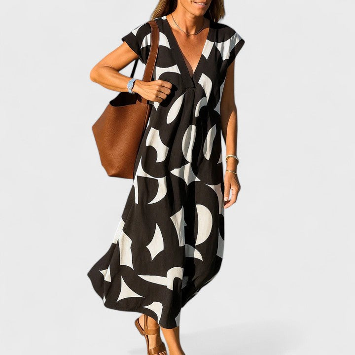 Chic Women's V-Neck Maxi Dress with a flowing silhouette. Ideal for summer, beach, or elegant evening occasions.