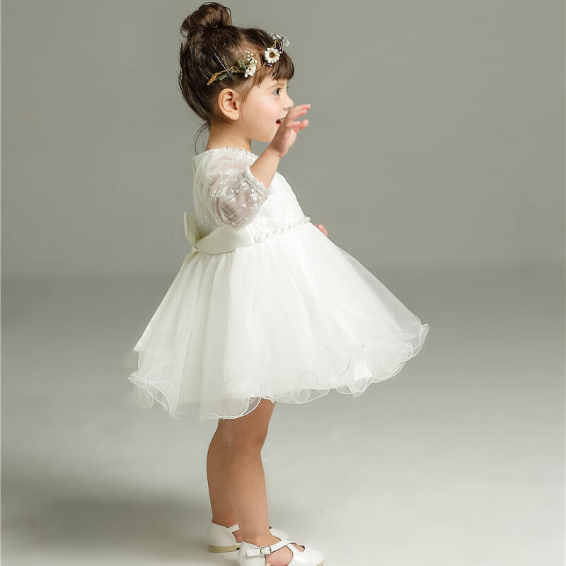 Charming polka dot Clara dress for girls, perfect as a flower girl dress or elegant birthday party outfit.