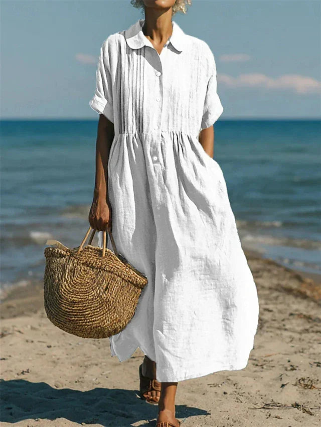 Women's relaxed fit pintuck maxi shirt dress with button front, collar, and pockets, ideal for summer casual wear.