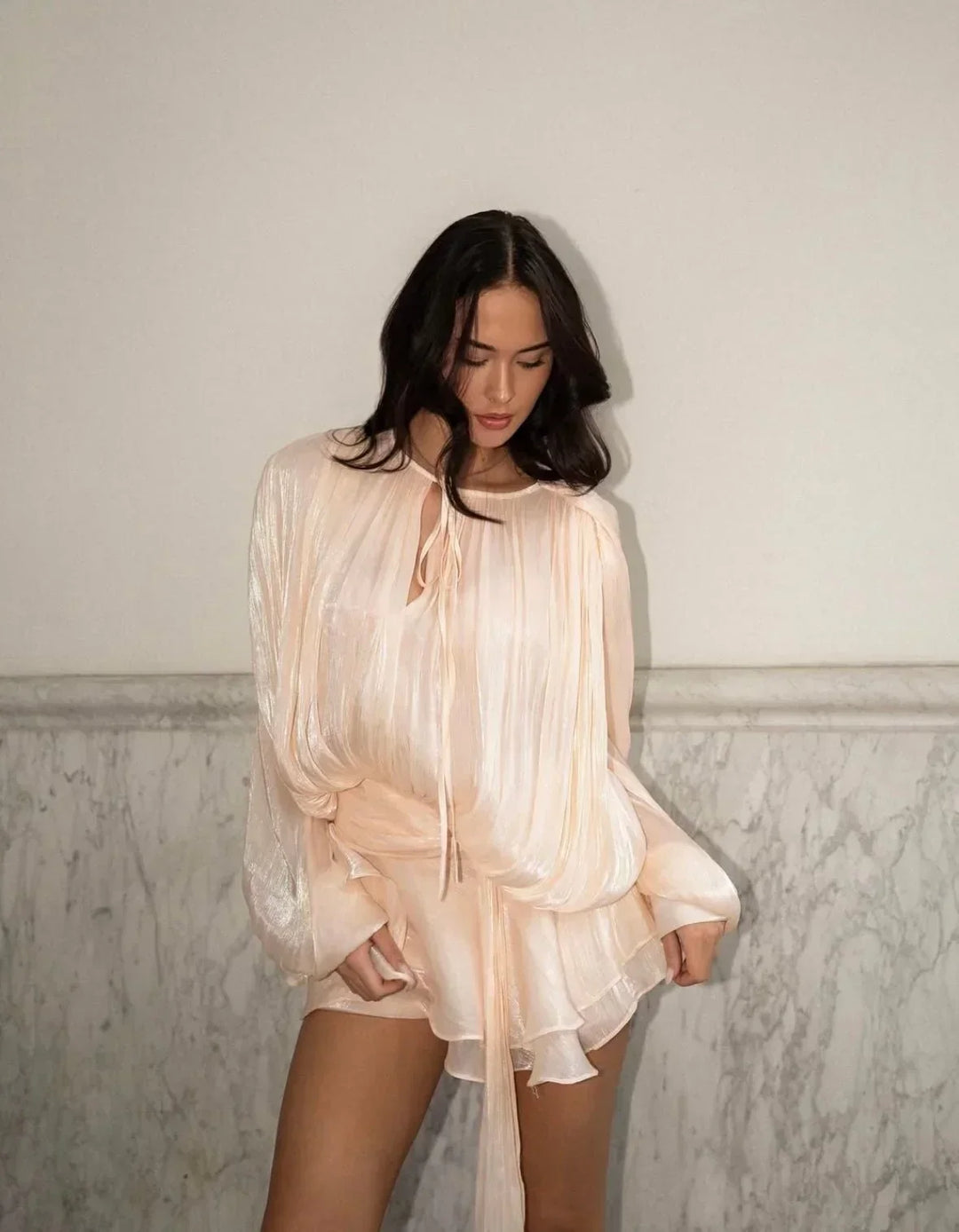 Chic women's pleated mini dress featuring stylish puff sleeves and a flattering tie-waist for summer.