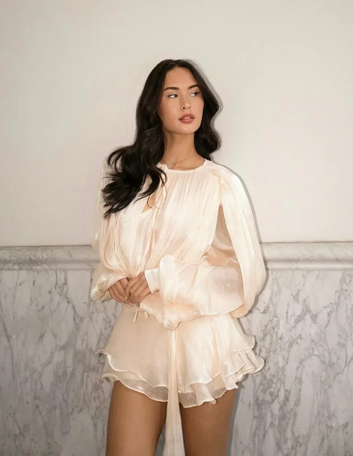 Elegant women's flowy mini dress with pleated details, puff sleeves & tie-waist. Perfect for summer events.