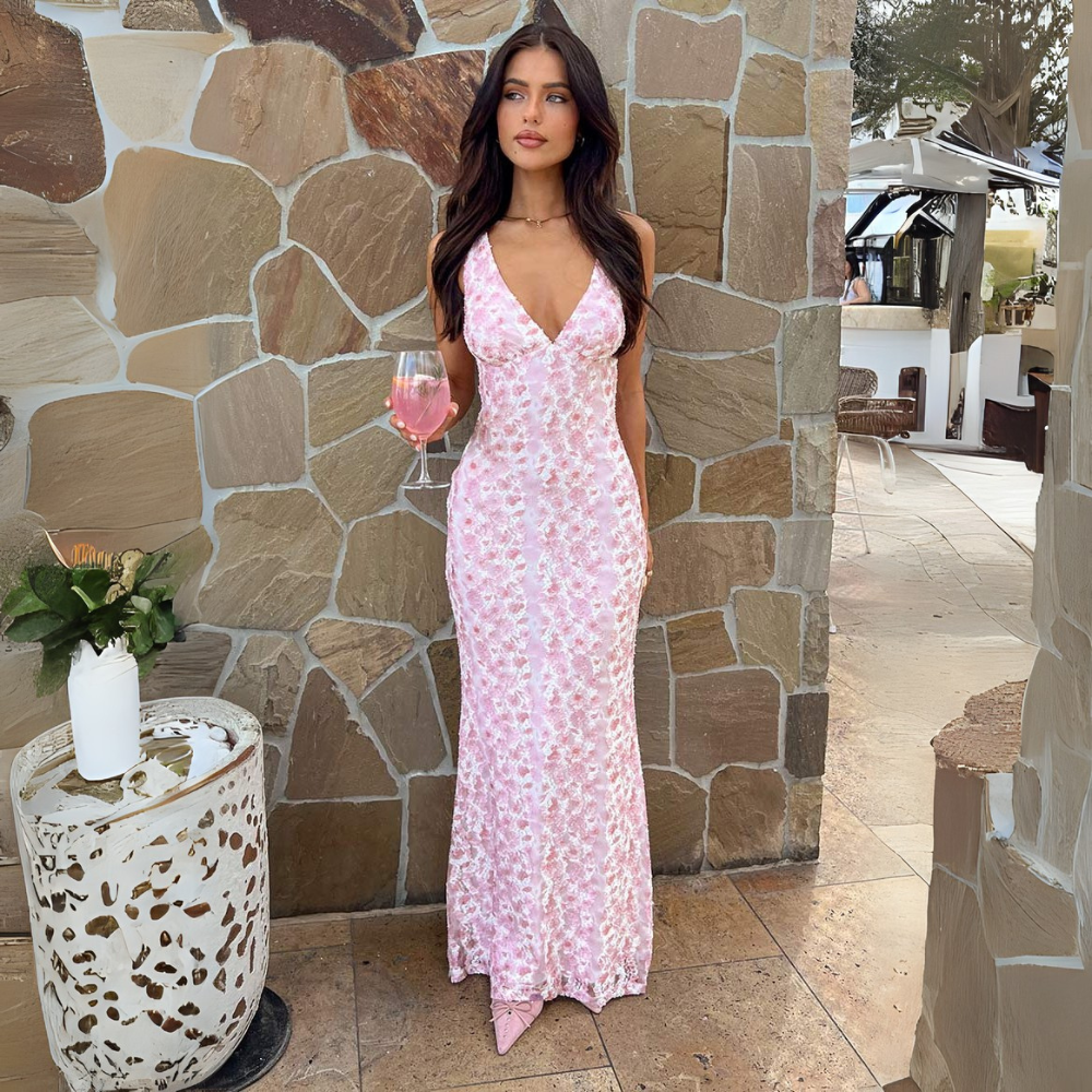 Romantic floral sleeveless wedding guest dress for women. Elegant V-neck maxi gown for parties.