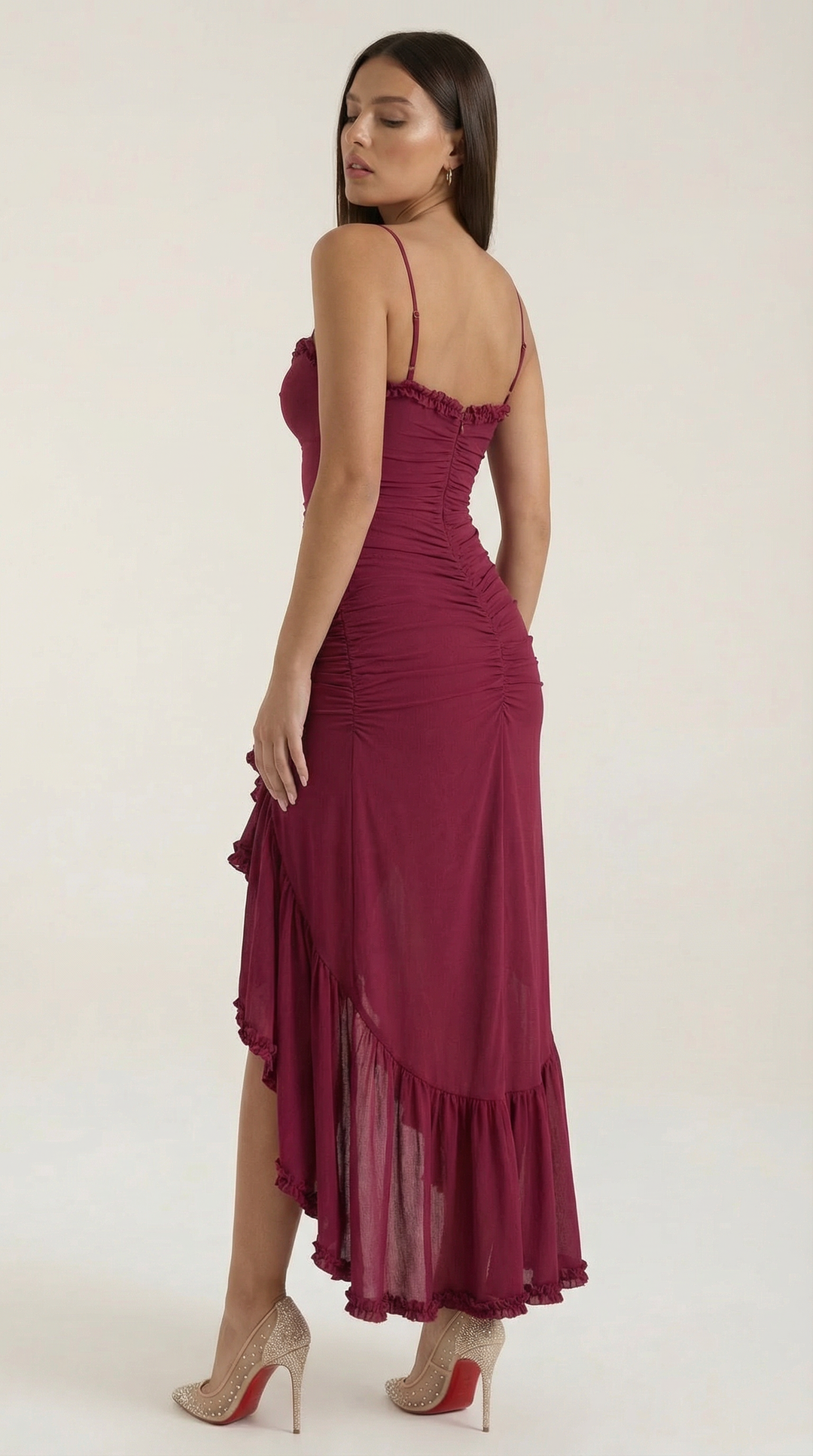 Women's high-low hem maxi dress, elegant ruffles, sleeveless design for celebrations.