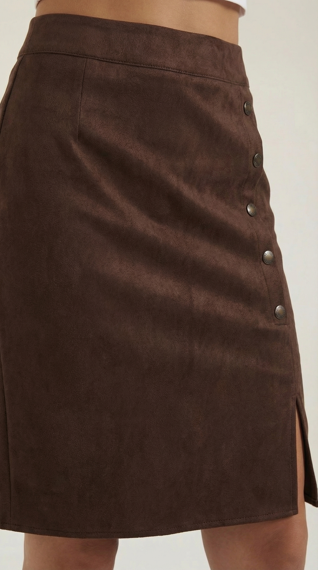 Women's high-waisted buttoned mini skirt, an elegant fashion staple for versatile styling.