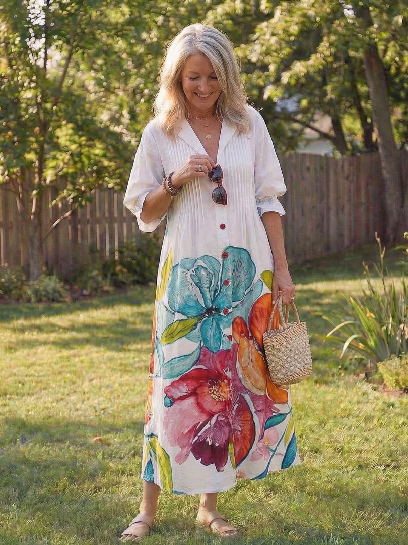 Chic women's button-front midi dress in a vibrant floral boho print, ideal for summer and beach outings.