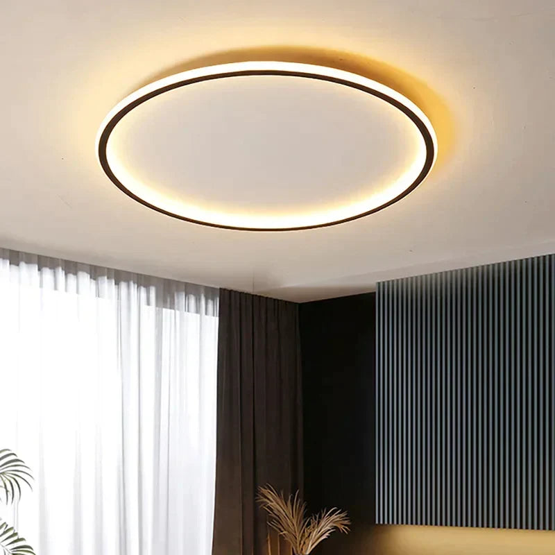 "Round LED ceiling light with Nordic design, offering soft illumination for modern living spaces, made of metal and glass."