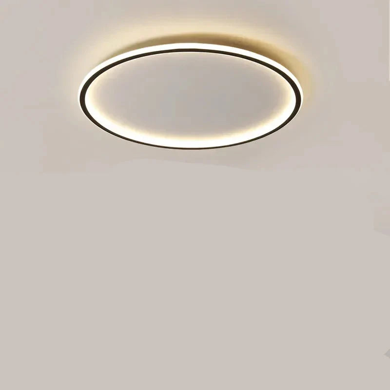 "Round LED ceiling light with Nordic design, offering soft illumination for modern living spaces, made of metal and glass."