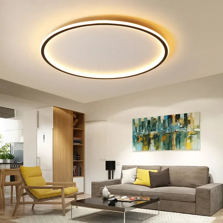 "Round LED ceiling light with Nordic design, offering soft illumination for modern living spaces, made of metal and glass."