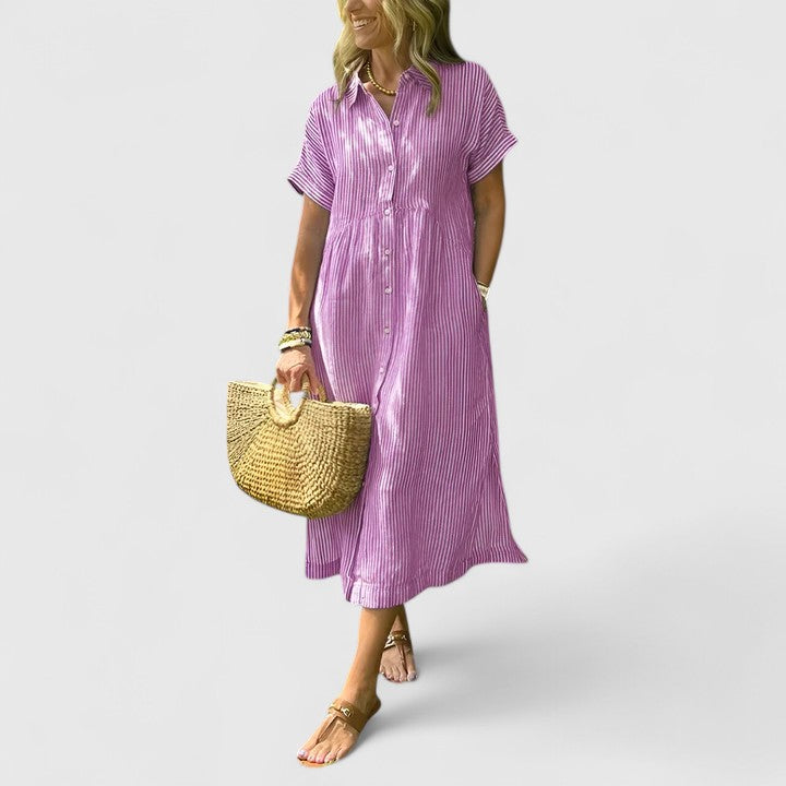 Detail of comfortable vertical stripe midi dress fabric, showcasing elegant pattern and quality.