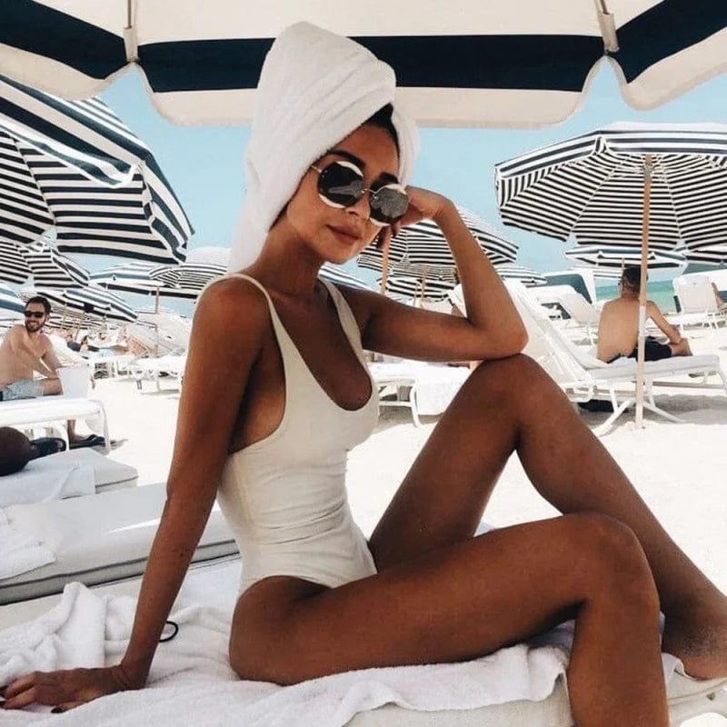 Classic style women's backless one-piece swimwear for sophisticated poolside fashion.