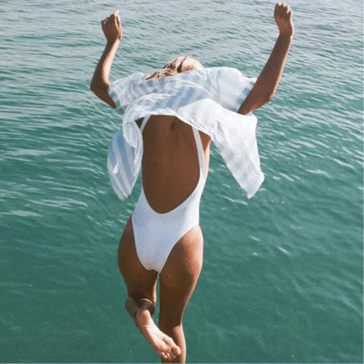 Women's elegant one-piece swimsuit with backless design, ideal for summer beachwear.
