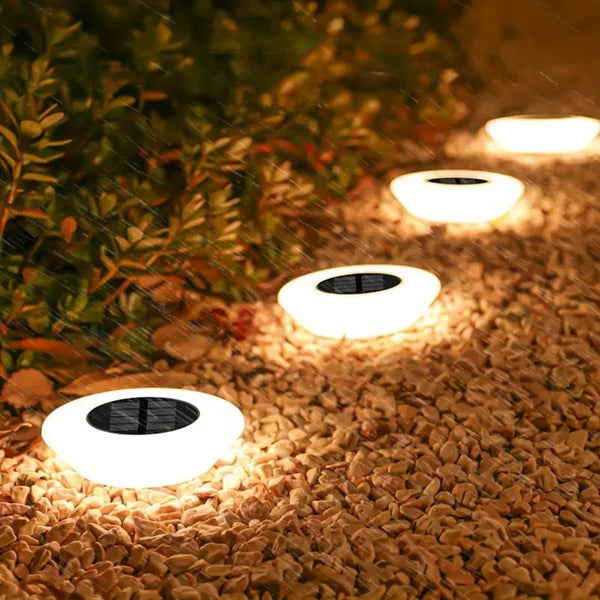 Rust-proof solar garden stake light, IP65 weatherproof, for bright outdoor pathway and landscape illumination.