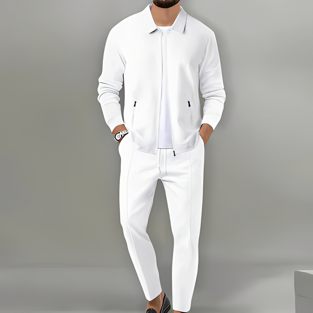 Dark men's two-piece activewear set. Zip-up jacket & comfortable tracksuit pants for sports or loungewear.