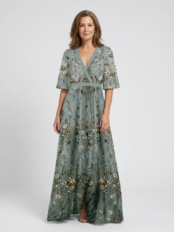 Flowy sage green floral embroidered maxi dress, ideal for summer special occasions & wedding guests.