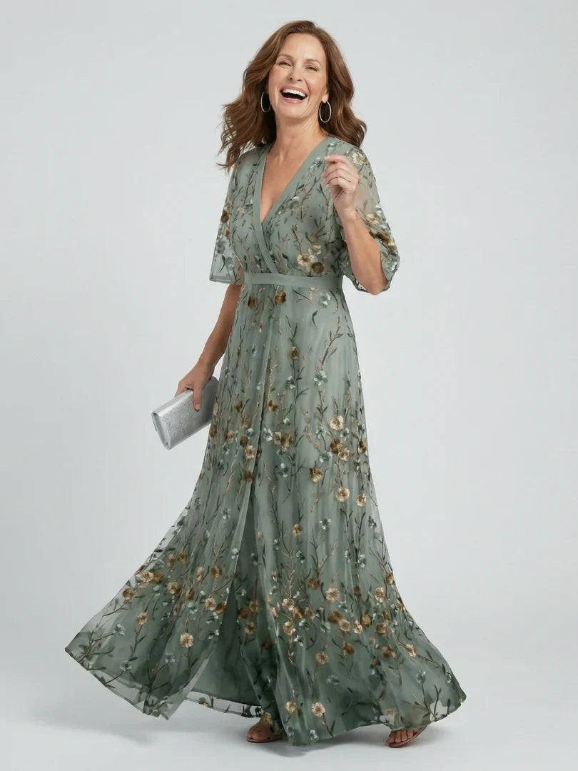 Elegant women's summer maxi dress with beautiful floral embroidery, perfect for garden parties.