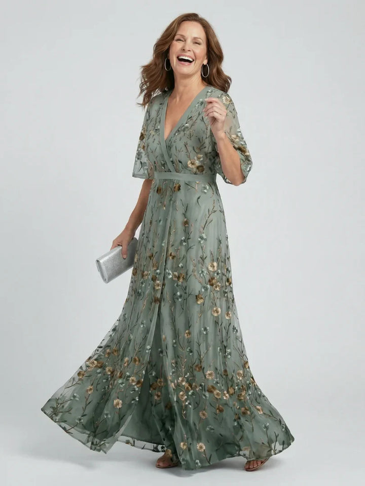 Elegant women's summer maxi dress with beautiful floral embroidery, perfect for garden parties.
