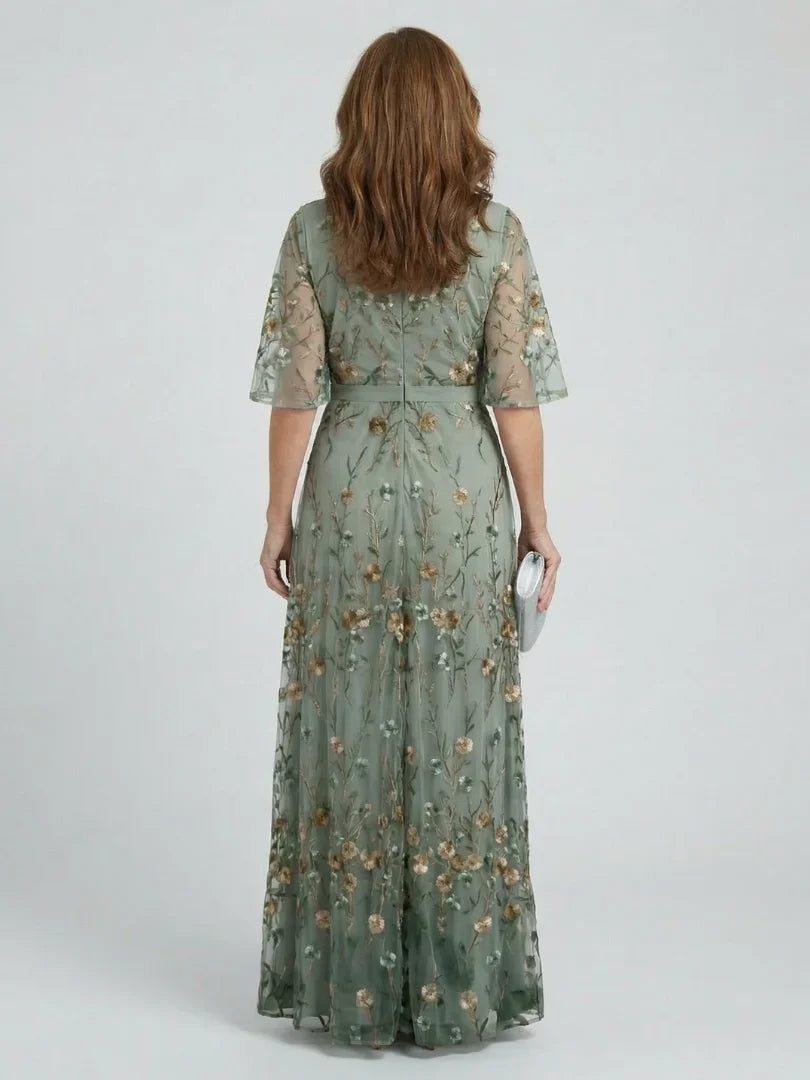 Boho sage green women's maxi dress with intricate floral embroidery. Perfect for summer events.
