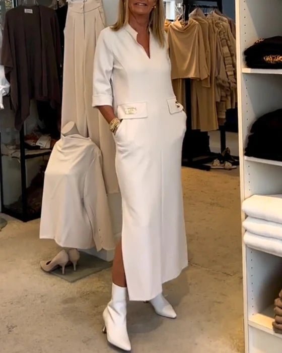 Elegant white women's spring dress with a flattering silhouette, perfect for day or evening events. Comfortable and stylish.