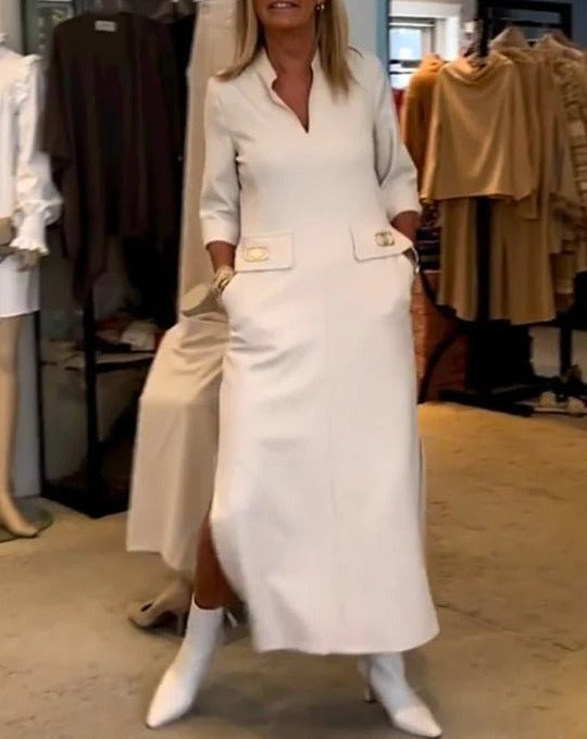 White elegant women's spring dress. Feminine, flattering, and comfortable, suitable for both casual and evening wear.