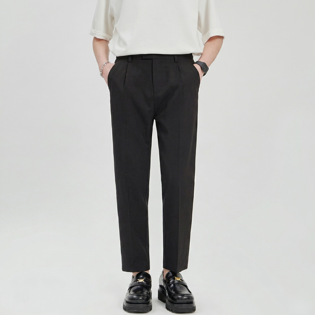 Comfort fit men's wide leg pleated chinos with drawstring waist. Relaxed and versatile trousers for smart casual style.