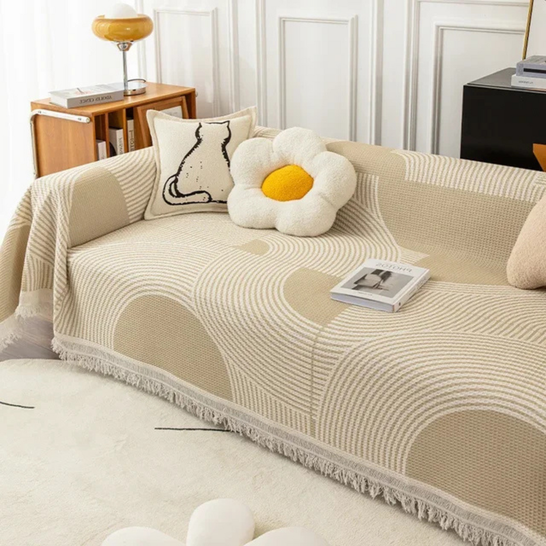 Scandinavian throw blanket with tassel edge, soft texture, cozy Nordic style, perfect for sofa decor and protection.