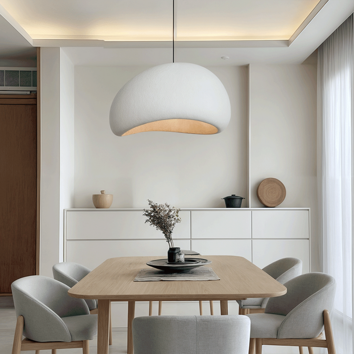 Living room sculpted dome pendant light, adjustable, providing modern and elegant interior ceiling illumination.