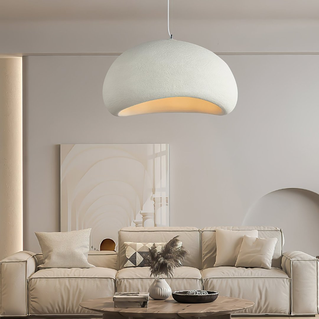 Unique sculpted dome pendant light with adjustable height, a striking modern ceiling fixture for minimalist design.