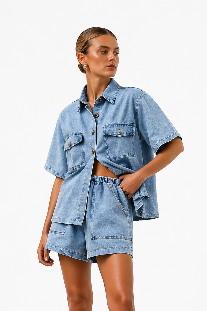 Stylish women's denim button-front shirt paired with high-waist shorts, a trendy two-piece summer outfit.