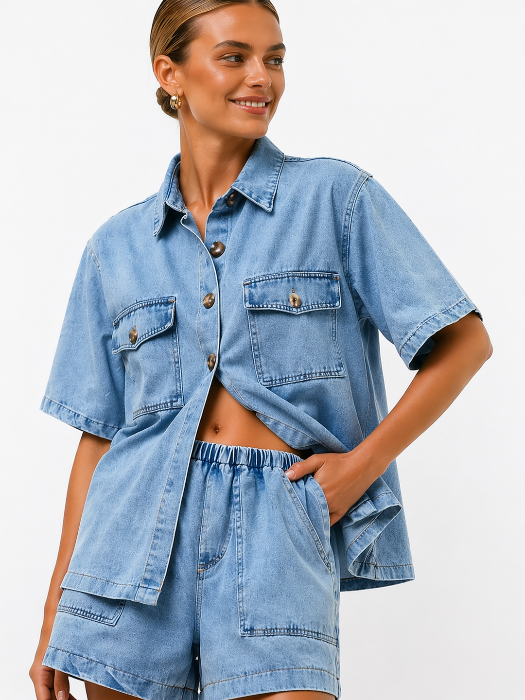 Blue denim women's two-piece set with a collared button shirt and flattering high-waist shorts, casual style.
