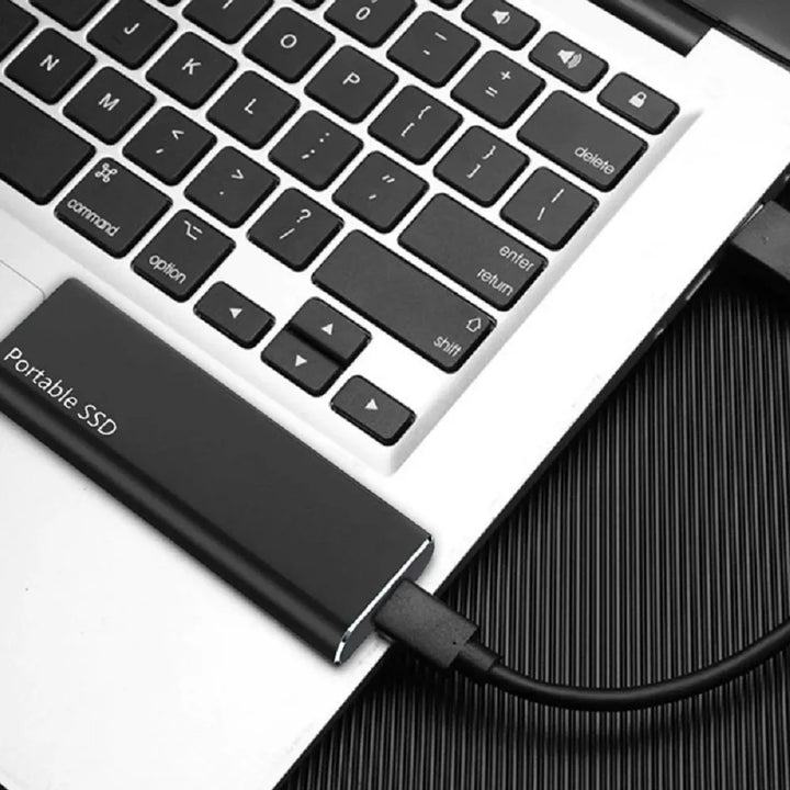 Sleek 4TB USB-C external drive with slim metal casing, ideal for portable storage, compatible with PC and Mac.